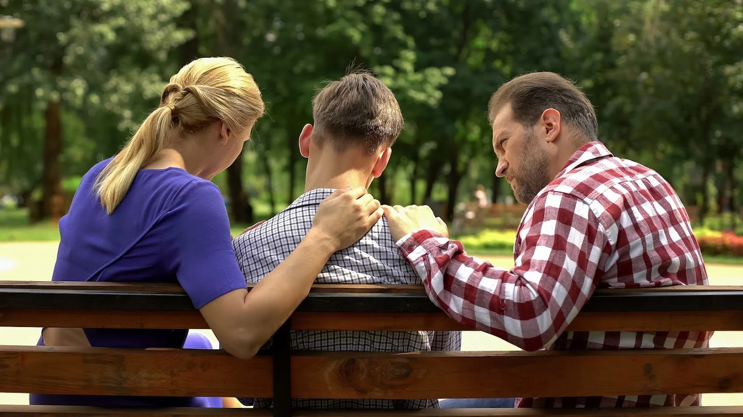  Image of a mom and dad comforting a teen. If you're looking for support, and Tampa therapy for your family, our therapists in Tampa have some tips! You won't regret it!  