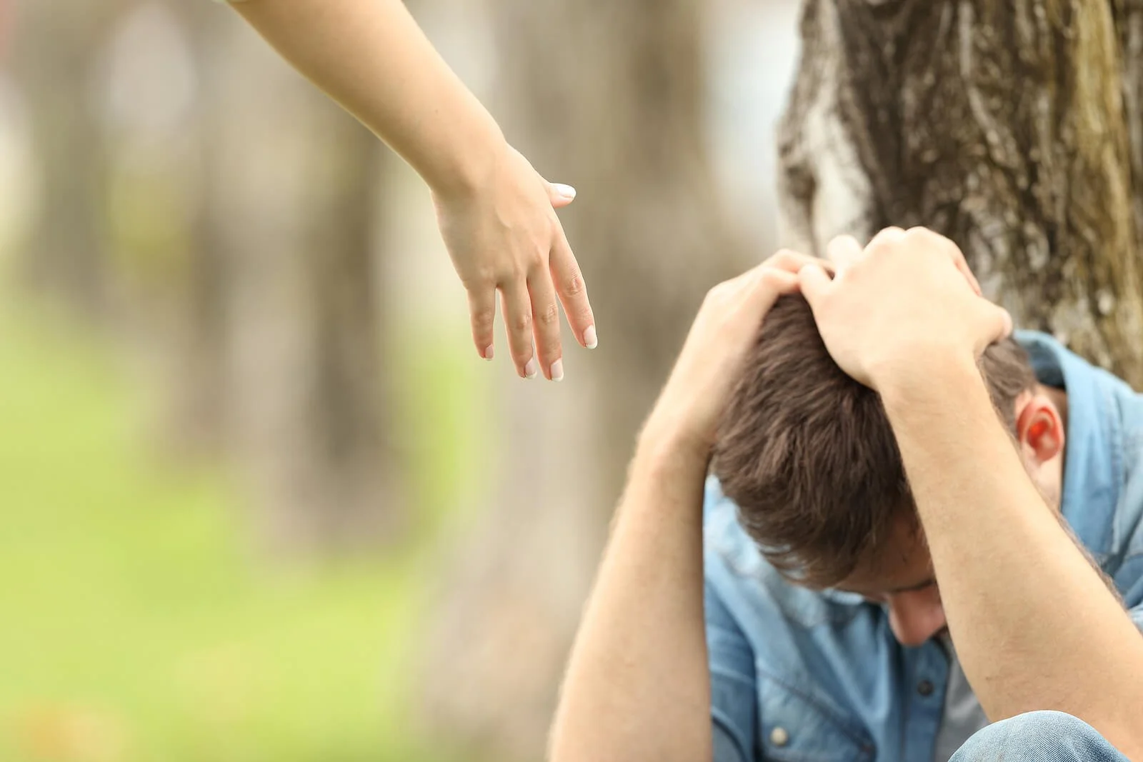  A helping hand reaches toward an upset teen sitting with their hands over their head. This could represent the support anxiety treatment in Broomfield, CO can offer. Learn more about anxiety treatment in Boulder, CO, and other services today by contacting an anxiety therapist in Broomfield, CO. 80020 
