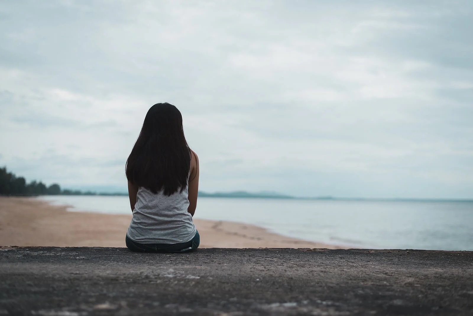  A lone woman sits overlooking a cloudy shoreline. This could represent the isolation that anxiety treatment in Broomfield, CO can address. Contact an anxiety therapist in Broomfield, CO to learn more about therapy for anxiety in Broomfield, CO, and other locations. 80020 